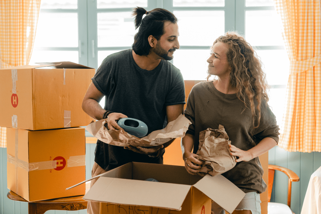 Couple unboxing items in a new home