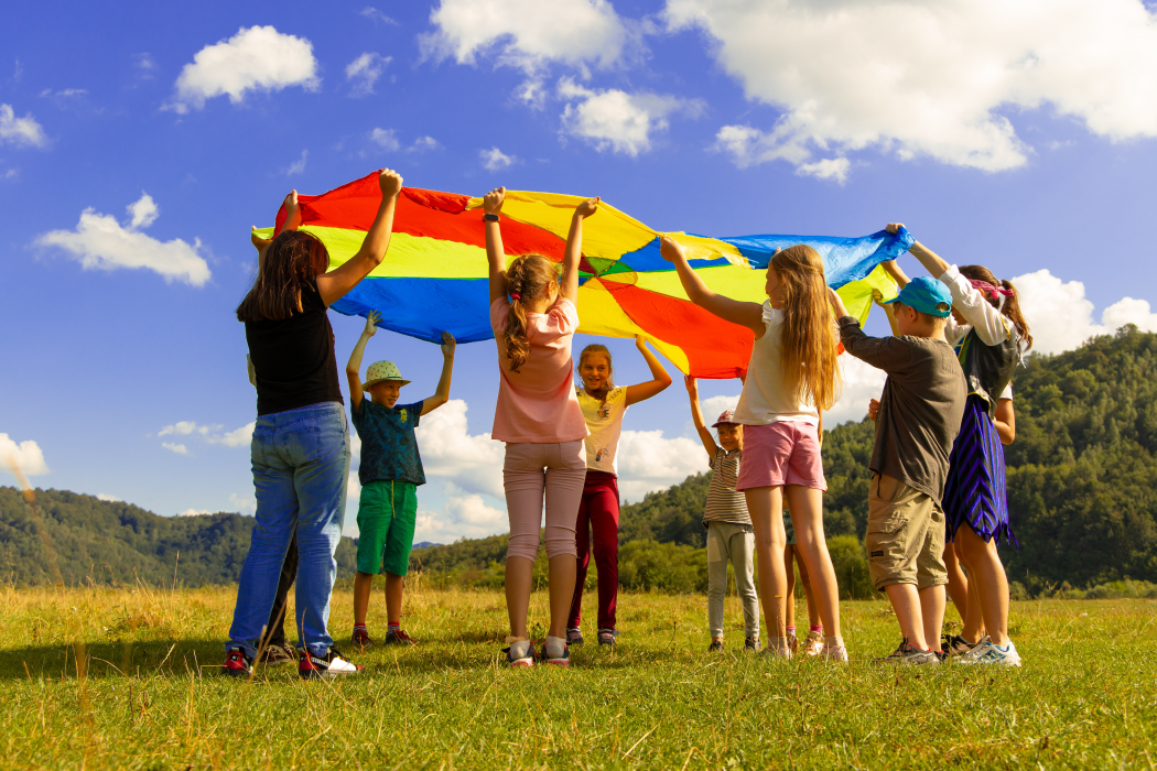 Children playing with a parachute in a circle