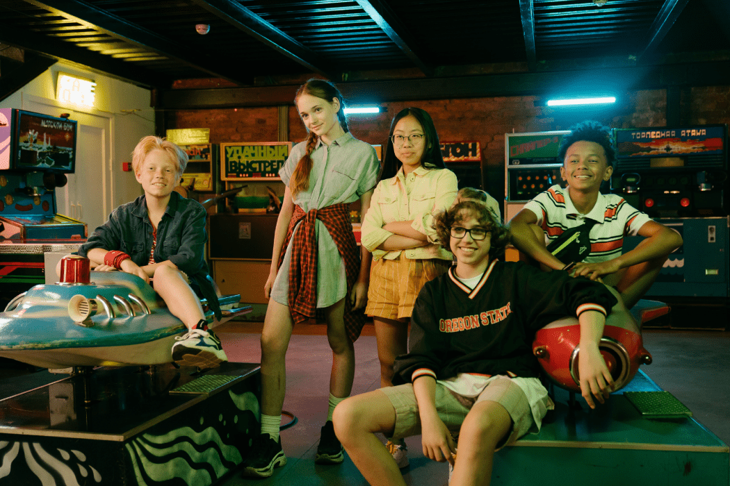 Group of kids hanging out at an arcade