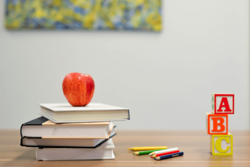 School supplies in a classroom on a desk