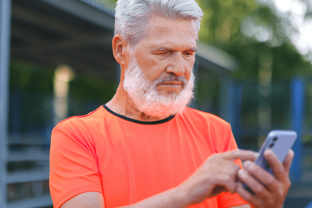 Senior man using cellphone for online banking