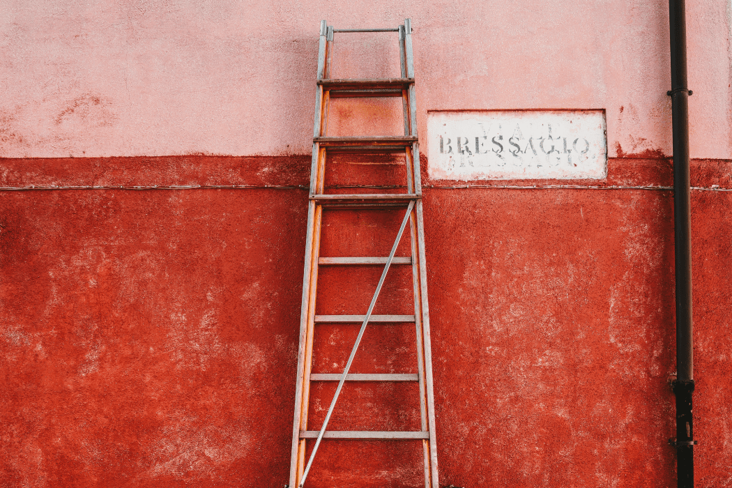 Ladder leaning up against a wall