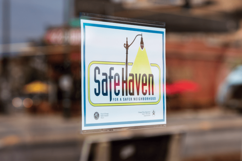 Safe Haven sign hanging in Liberty Bank window