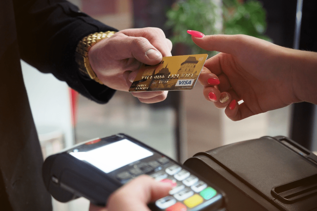 Customer using a debit card to pay for a product at a store