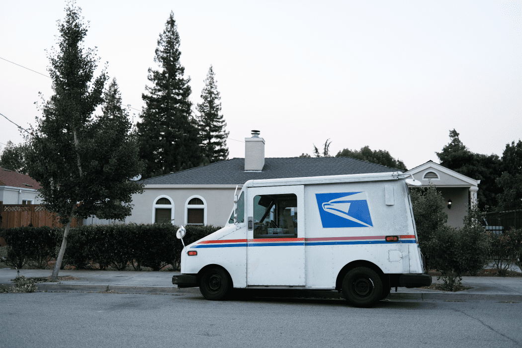 USPS truck outside of a residential home