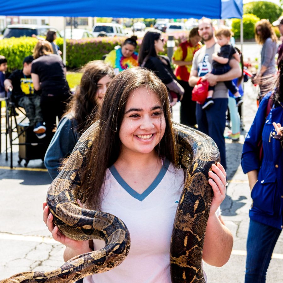 teen at community event with snake