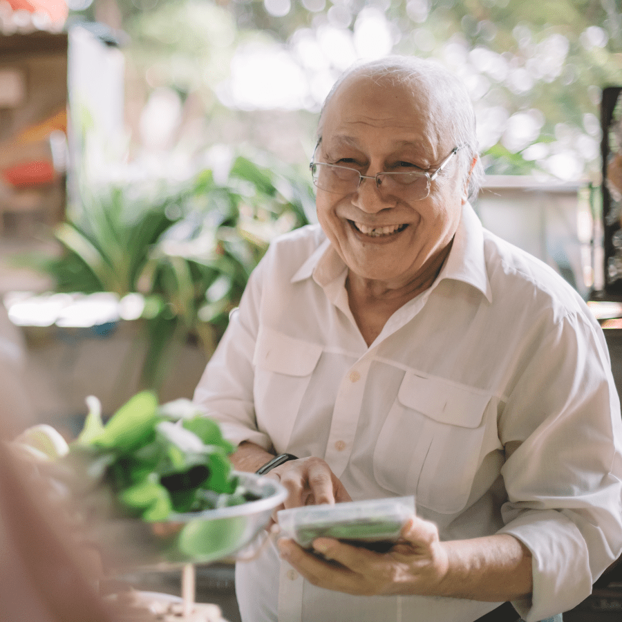 Senior speaking to a customer