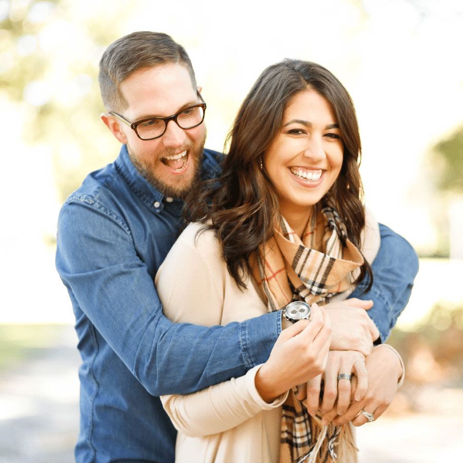 Husband with his arms around his wife