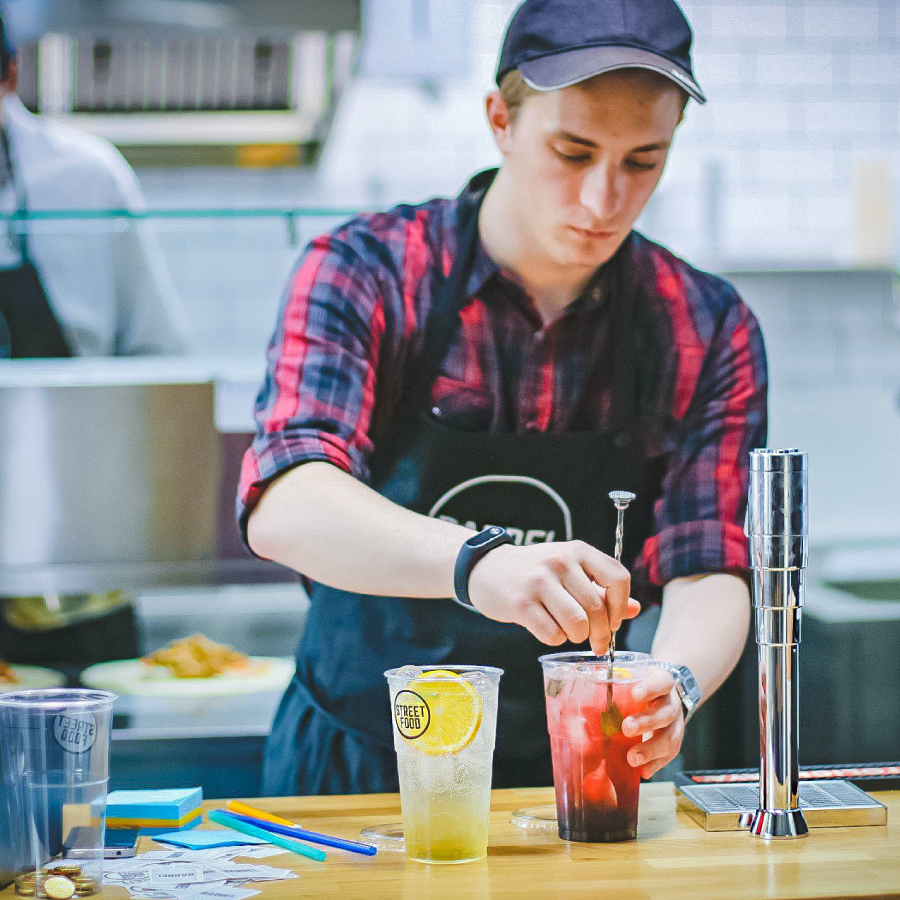 Man making a drink for a customer