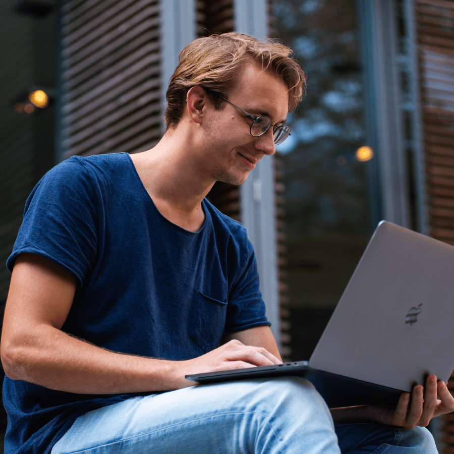 Man sitting outside on his laptop