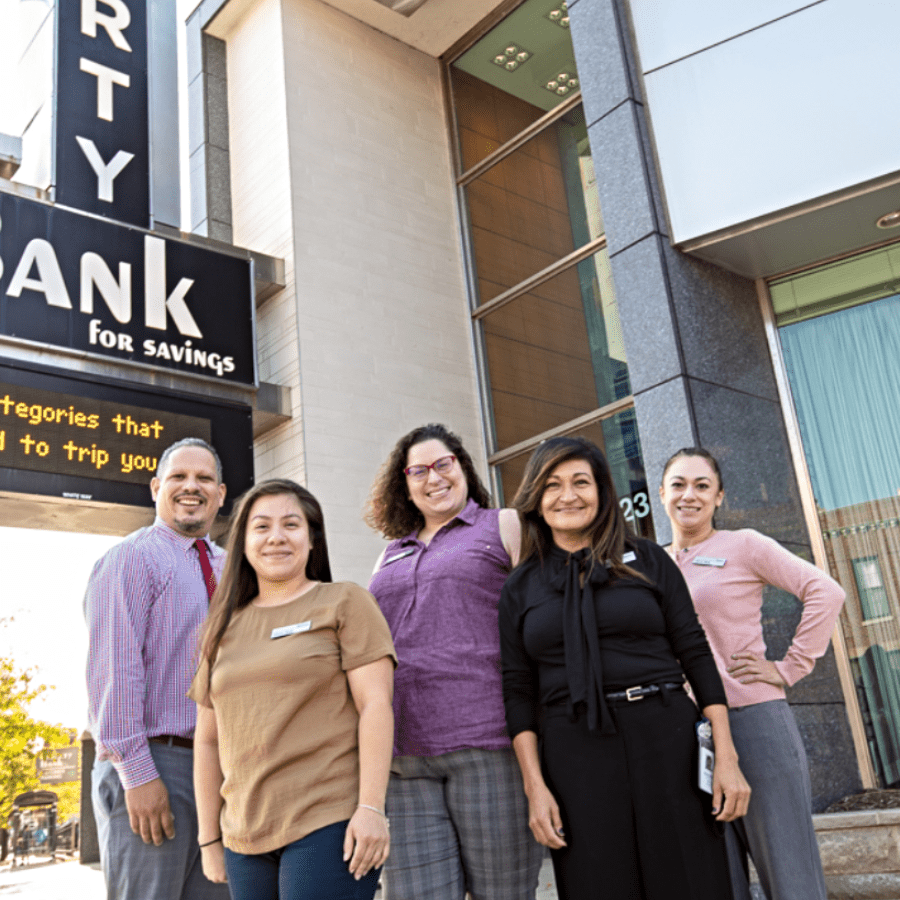 employees in front of bank