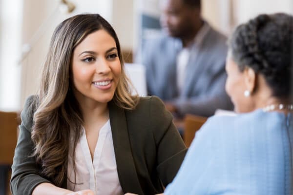 woman banker sitting with a client