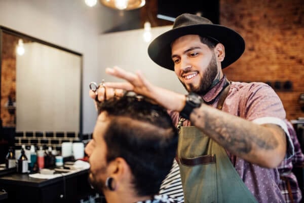 barber cutting a customers hair