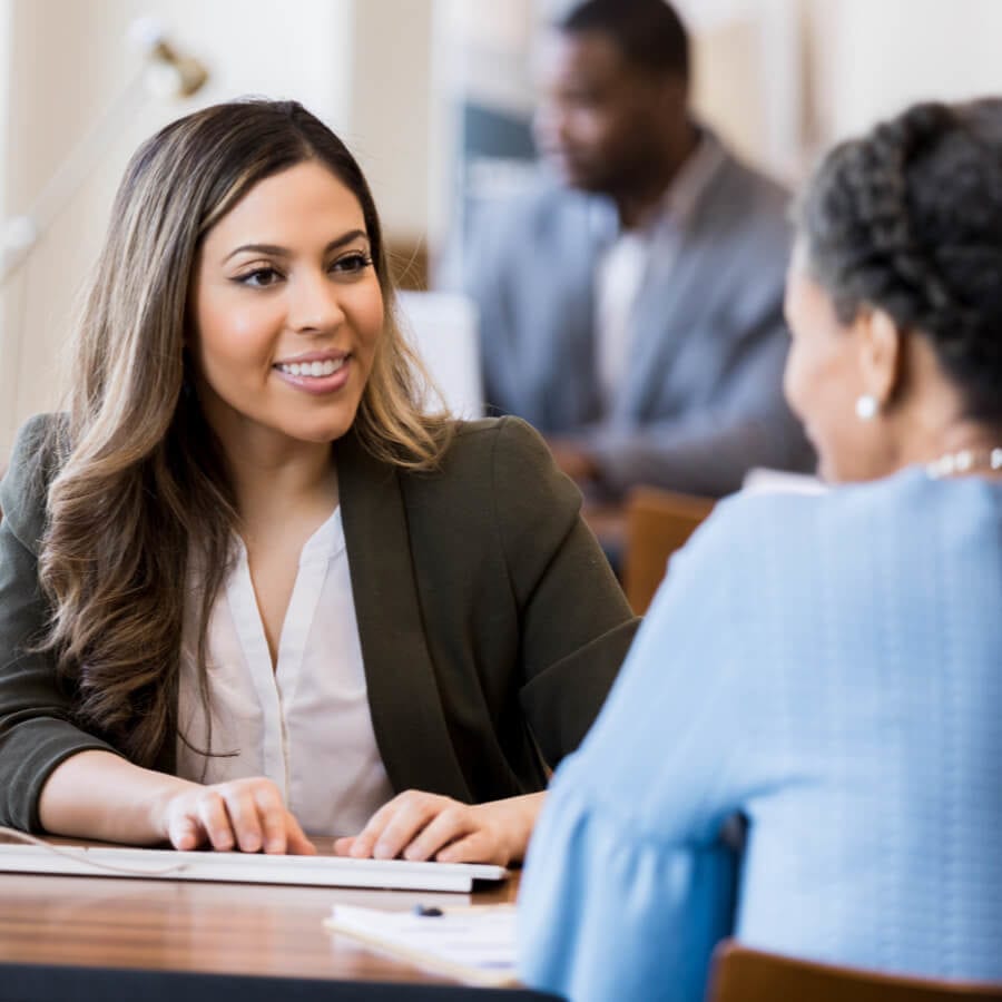 banker sitting with a customer