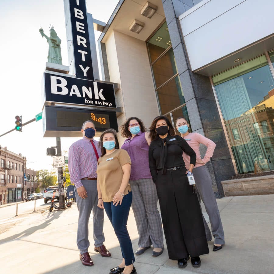 Liberty Bank retail staff posing outside the Logan Square office