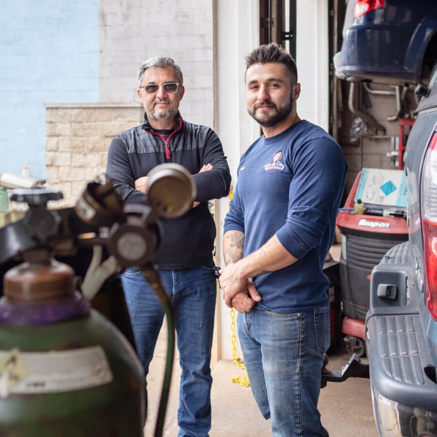 Two Liberty customers in their auto shop