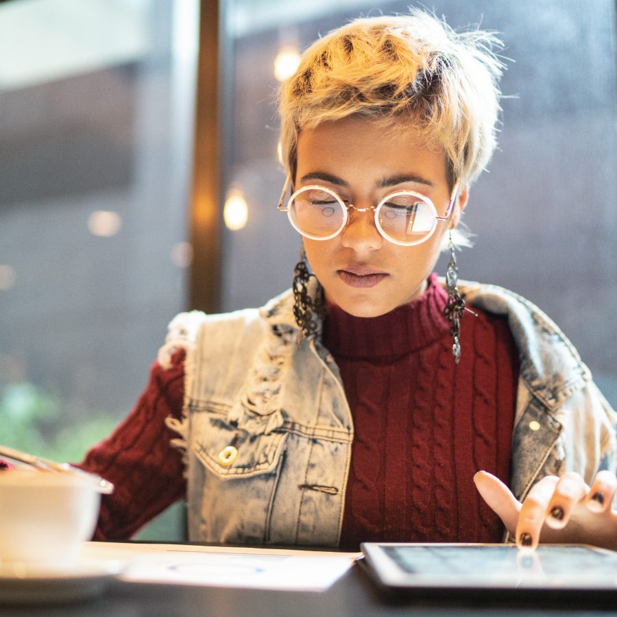 Woman checking some graphics from digital investment stock photo