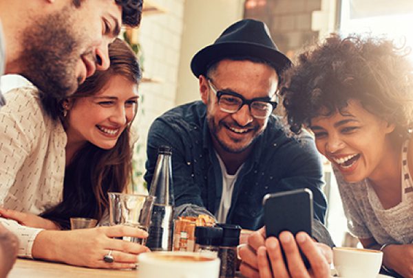 friends looking at a cell phone