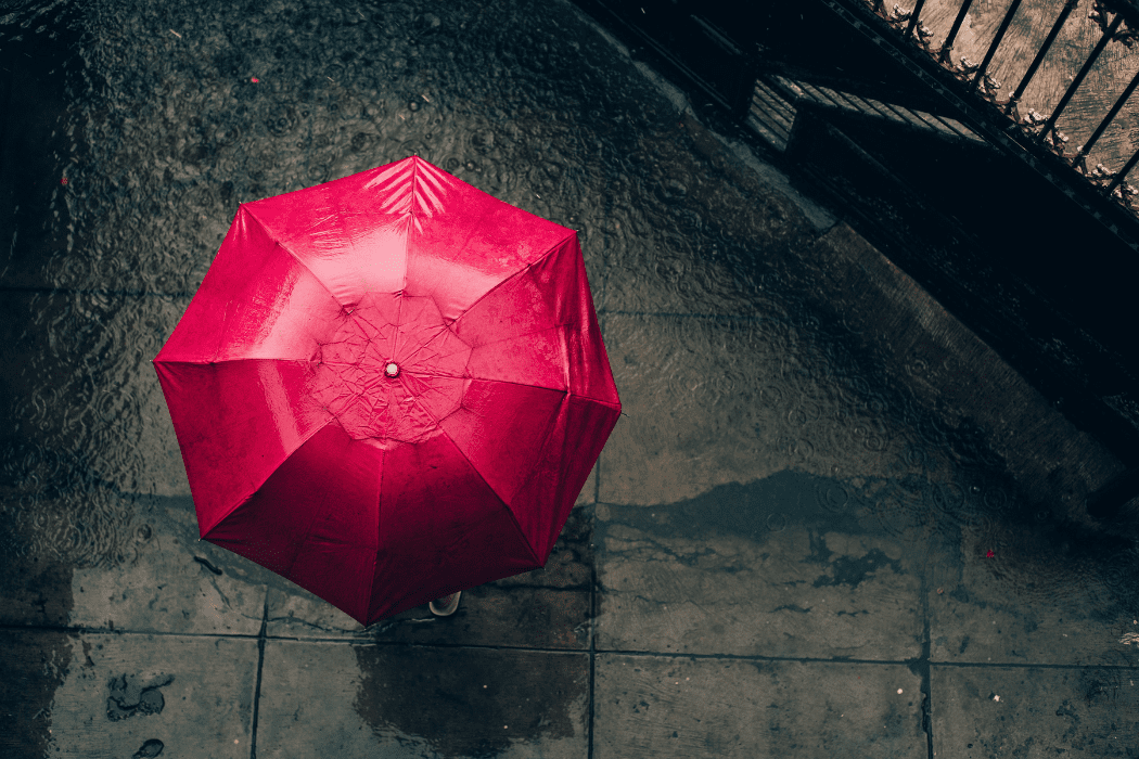 red umbrella and concrete floor