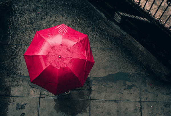 red umbrella and concrete floor