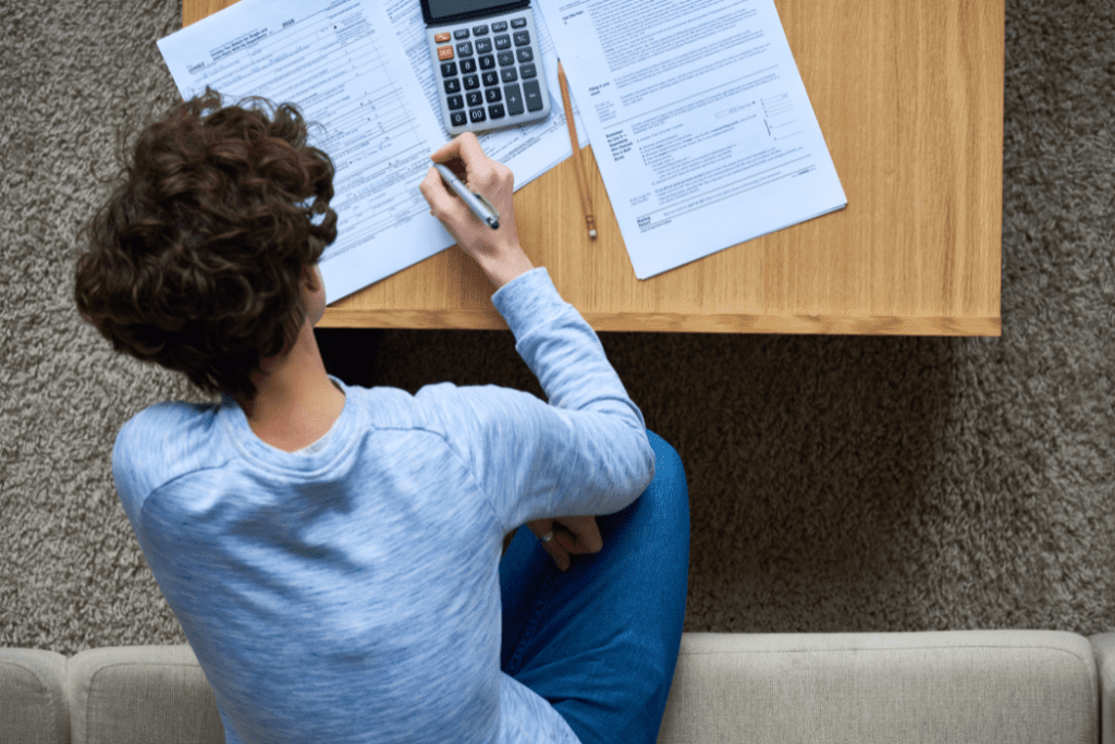 Woman working on taxes in living room